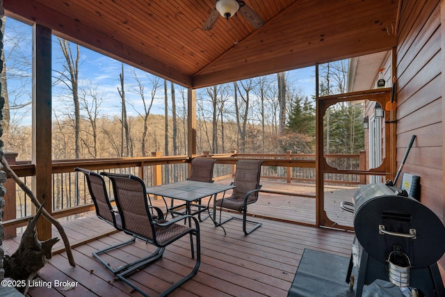 deck with grilling area and ceiling fan