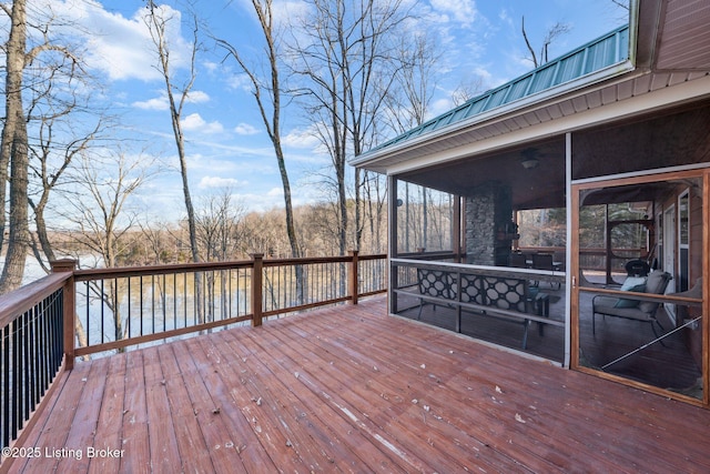 wooden deck with a sunroom