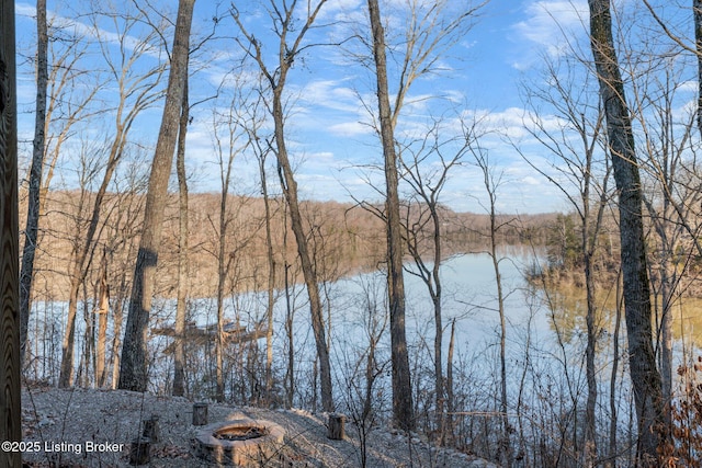 property view of water featuring an outdoor fire pit