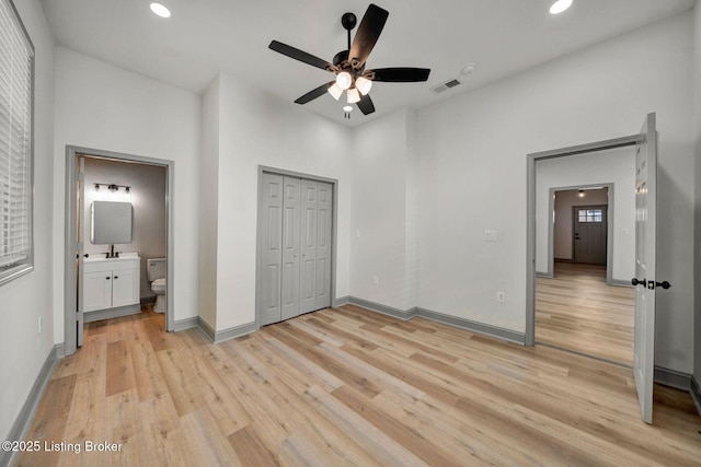 unfurnished bedroom featuring visible vents, ensuite bathroom, recessed lighting, light wood finished floors, and baseboards