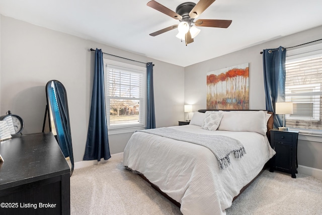 bedroom with baseboards, light colored carpet, and ceiling fan