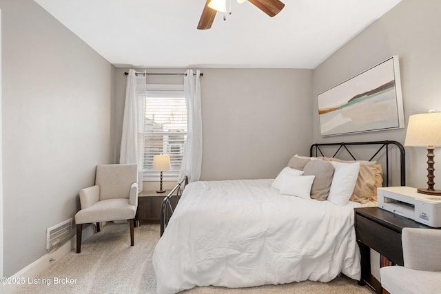 bedroom featuring carpet flooring, baseboards, visible vents, and ceiling fan