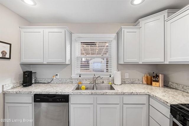 kitchen with a sink, light countertops, white cabinets, and stainless steel appliances