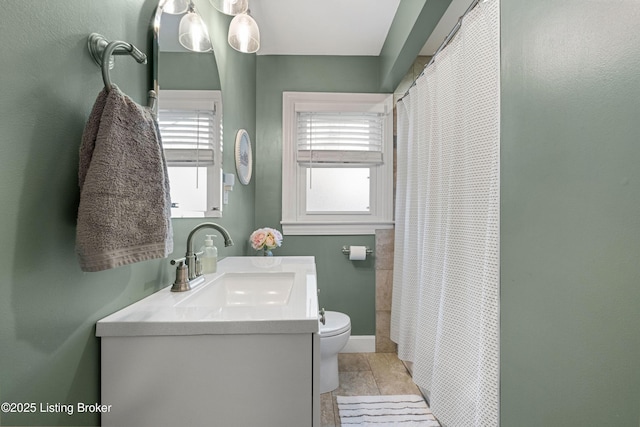 full bathroom with vanity, curtained shower, and toilet