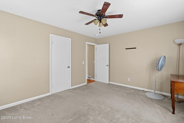 unfurnished bedroom with carpet flooring, ceiling fan, and baseboards