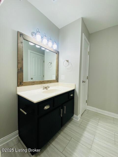 bathroom featuring vanity and baseboards