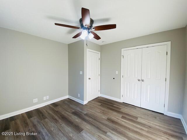 unfurnished bedroom featuring a closet, ceiling fan, baseboards, and wood finished floors