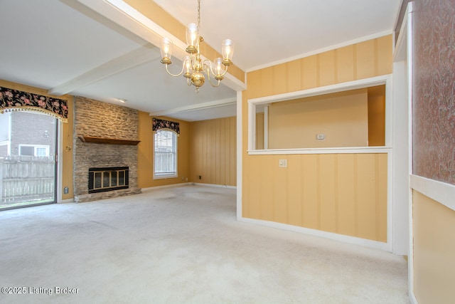 unfurnished living room featuring beamed ceiling, a notable chandelier, carpet, a fireplace, and baseboards