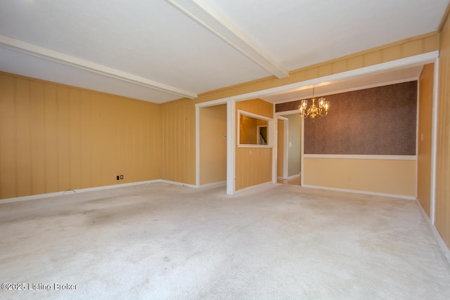 unfurnished room with beamed ceiling, light colored carpet, baseboards, and an inviting chandelier