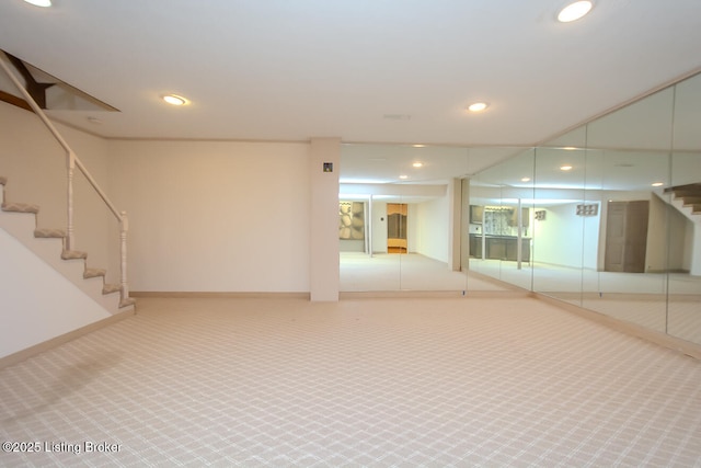 basement with stairs, recessed lighting, baseboards, and carpet floors