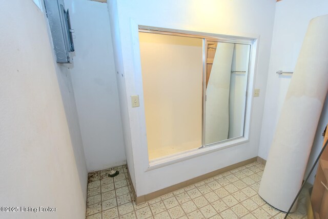 bathroom featuring tile patterned floors and baseboards