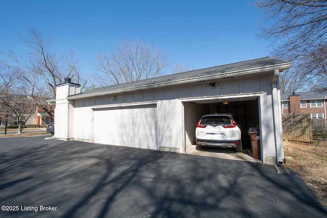 detached garage with fence