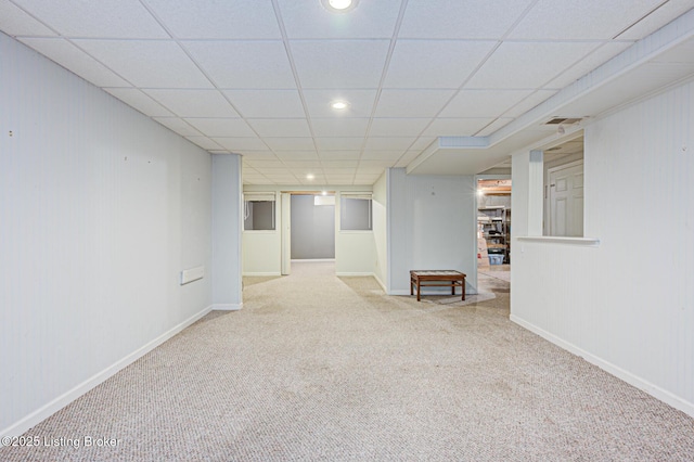 finished basement with carpet flooring, recessed lighting, baseboards, and a drop ceiling