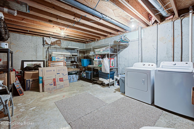 unfinished basement with washing machine and clothes dryer