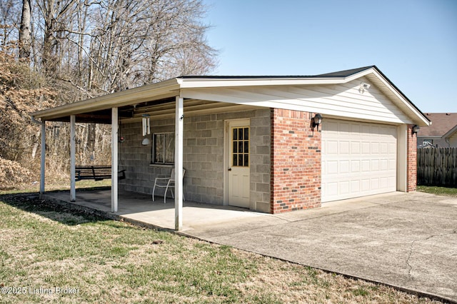 exterior space with a garage and fence