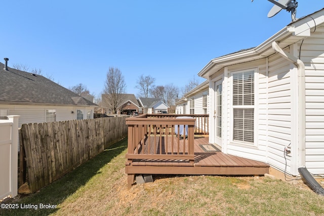 view of yard with a deck and fence