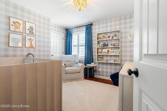 bedroom featuring baseboards and wallpapered walls