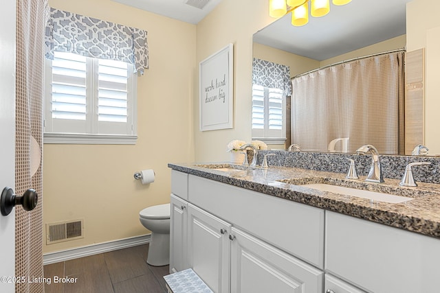 full bathroom featuring a sink, visible vents, and plenty of natural light