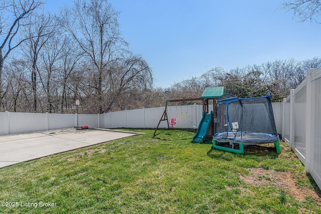 view of yard featuring a fenced backyard, a patio, a playground, and a trampoline