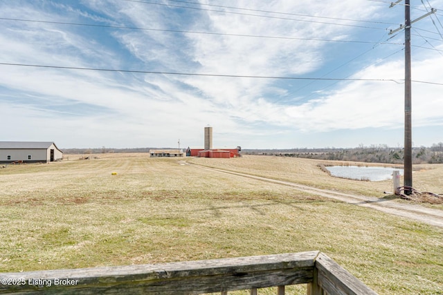 view of yard with a rural view