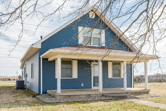 view of front of property with covered porch and cooling unit