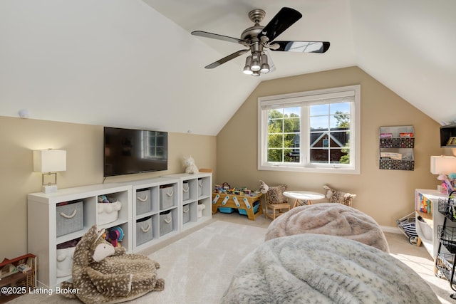 recreation room featuring vaulted ceiling, carpet flooring, a ceiling fan, and baseboards