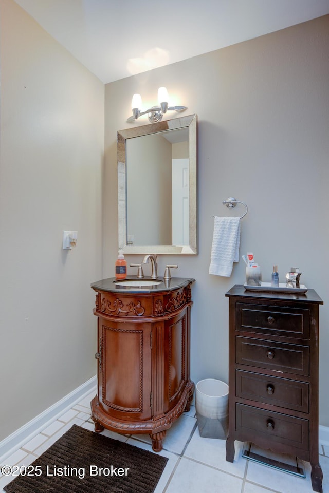 bathroom with tile patterned flooring, vanity, and baseboards