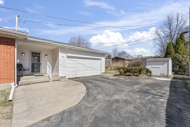 garage featuring a storage unit