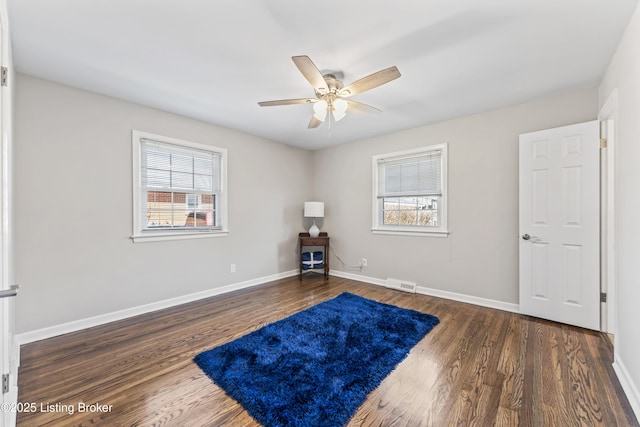 miscellaneous room with wood finished floors, visible vents, and a wealth of natural light