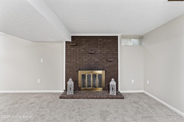 unfurnished living room featuring baseboards, a textured ceiling, a brick fireplace, and carpet flooring