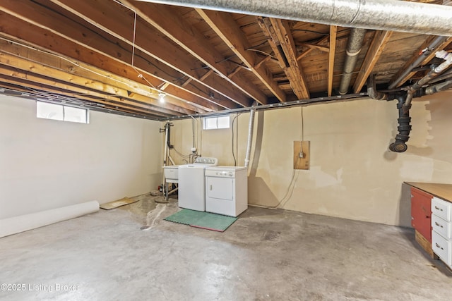 below grade area featuring a sink and washer and clothes dryer