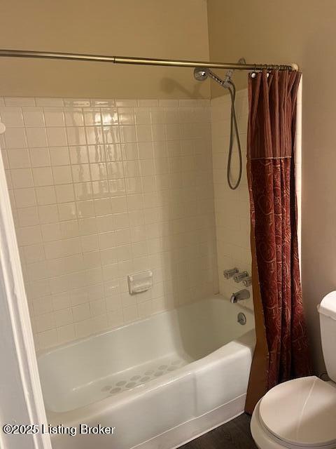 full bath featuring toilet and shower / tub combo