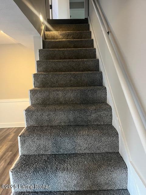 stairs with wood finished floors