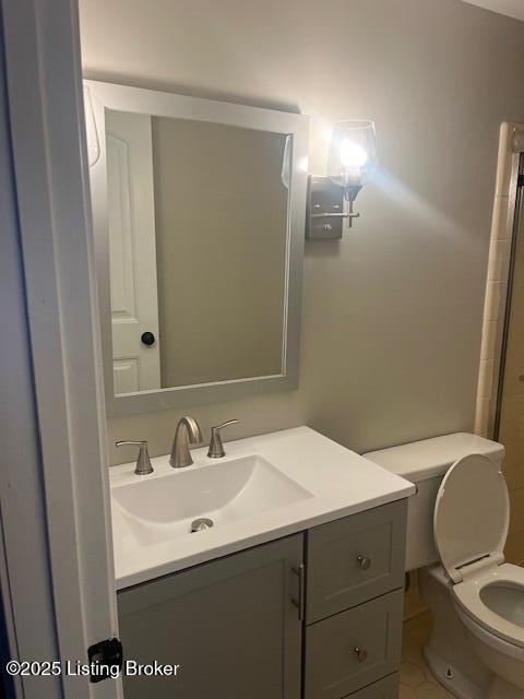 bathroom with toilet and vanity