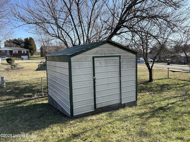 view of shed with fence