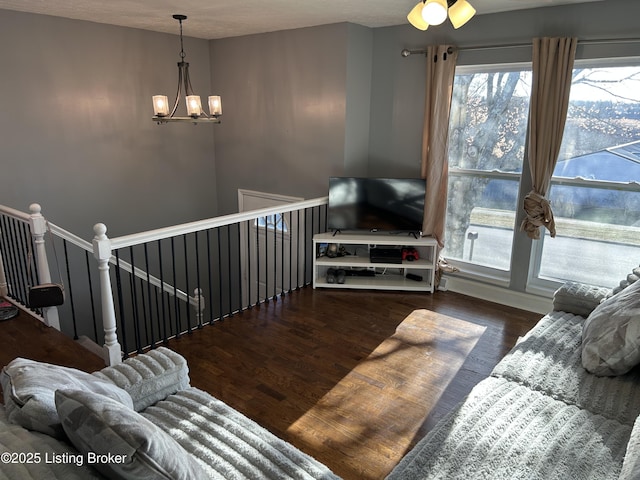 living room featuring a notable chandelier and wood finished floors