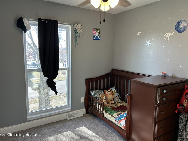 carpeted bedroom with visible vents and baseboards