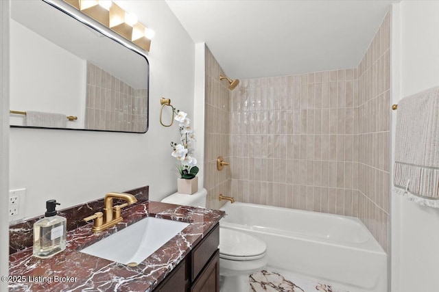 bathroom featuring toilet, vanity, and shower / tub combination