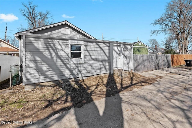 back of house featuring fence