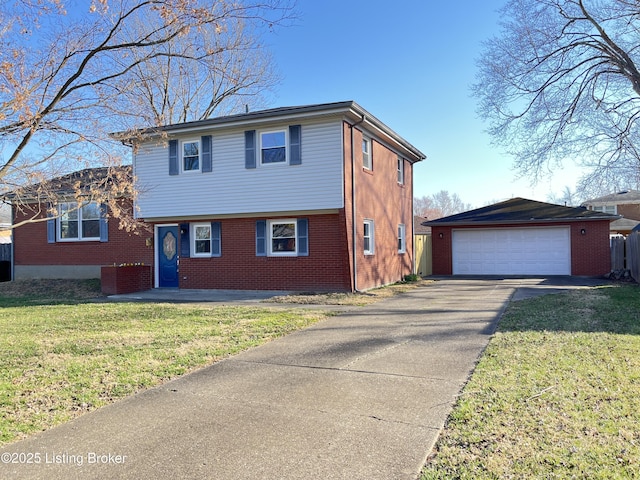 tri-level home featuring an outbuilding, a garage, brick siding, and a front yard