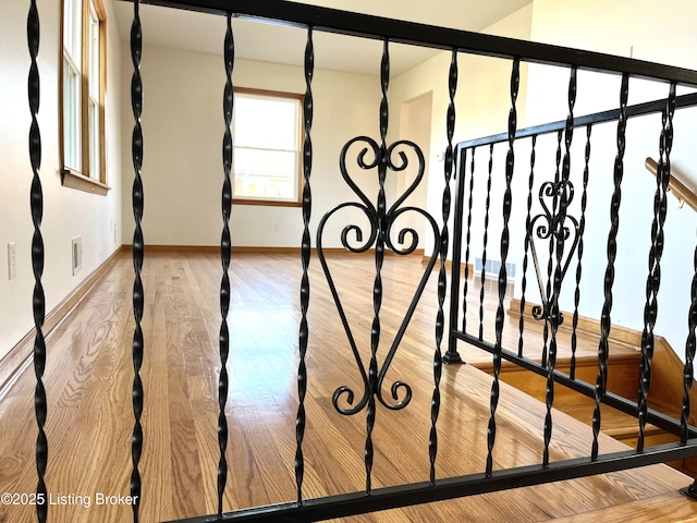 room details with visible vents, baseboards, and wood finished floors