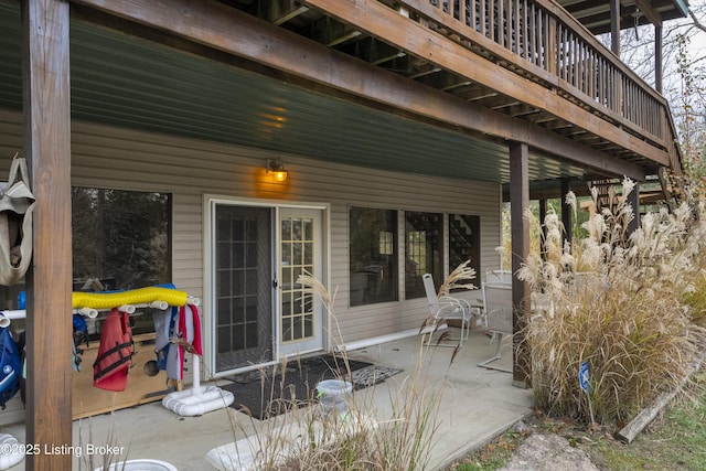 view of exterior entry featuring a patio