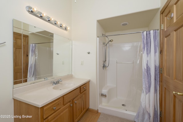 full bath with vanity and a shower with curtain