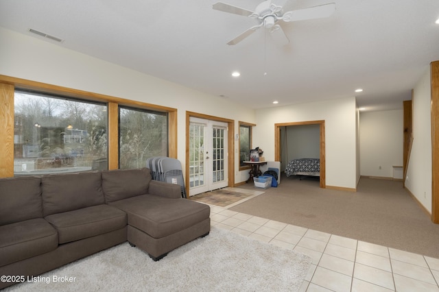 living room featuring visible vents, light carpet, recessed lighting, french doors, and light tile patterned floors