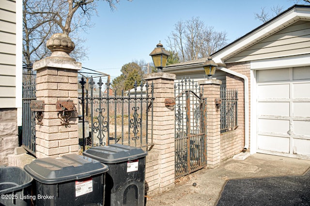 view of gate featuring fence