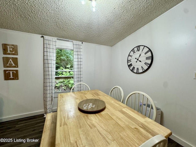 dining area featuring lofted ceiling, a textured ceiling, dark wood-type flooring, and baseboards