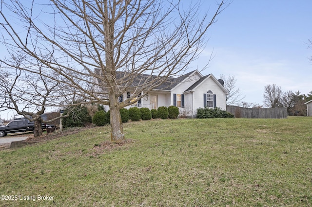 single story home featuring a front lawn