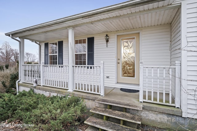 property entrance with covered porch