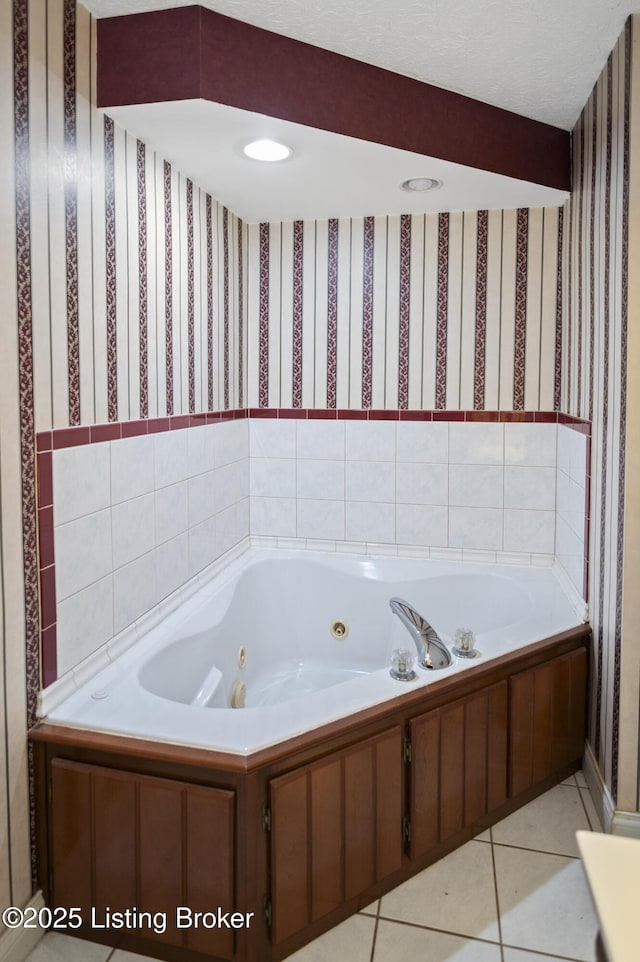 full bathroom with tile patterned floors, a tub with jets, and wallpapered walls