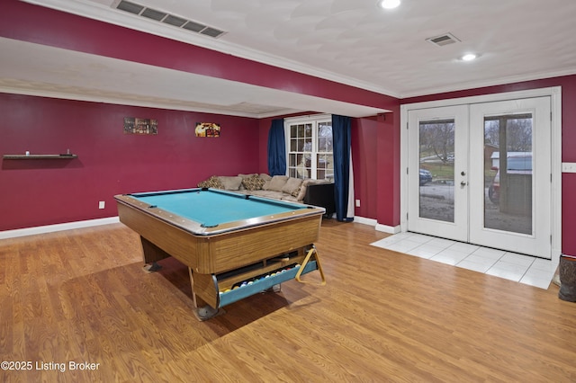 game room featuring wood finished floors, french doors, visible vents, and ornamental molding